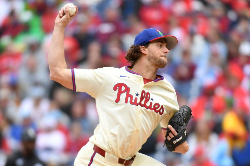 Apr 21, 2024; Philadelphia, Pennsylvania, USA; Philadelphia Phillies pitcher Aaron Nola (27) throws a pitch during the first inning against the Chicago White Sox at Citizens Bank Park. Mandatory Credit: Eric Hartline-USA TODAY Sports