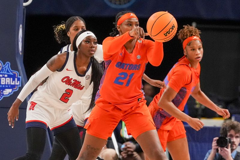 Mar 8, 2024; Greensville, SC, USA; Florida Gators forward Eriny Kindred (21) passes off against the Ole Miss Rebels during the first half at Bon Secours Wellness Arena. Mandatory Credit: Jim Dedmon-USA TODAY Sports