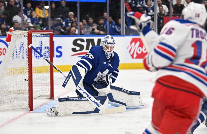 Mar 2, 2024; Toronto, Ontario, CAN; New York Rangers forward Vincent Trochek (16) scores a goal against Toronto Maple Leafs goalie Ilya Samsonov (35) in the second period at Scotiabank Arena. Mandatory Credit: Dan Hamilton-USA TODAY Sports