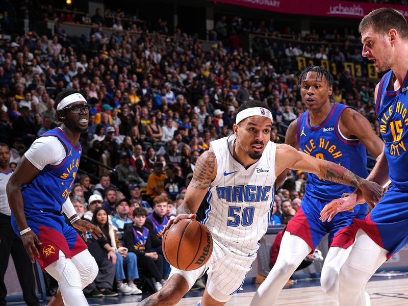 DENVER, CO - JANUARY 5: Cole Anthony #50 of the Orlando Magic drives to the basket during the game against the Denver Nuggets on January 5, 2024 at the Ball Arena in Denver, Colorado. NOTE TO USER: User expressly acknowledges and agrees that, by downloading and/or using this Photograph, user is consenting to the terms and conditions of the Getty Images License Agreement. Mandatory Copyright Notice: Copyright 2024 NBAE (Photo by Garrett Ellwood/NBAE via Getty Images)