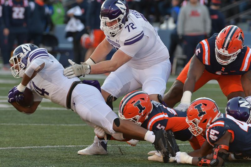 Nov 25, 2023; Champaign, Illinois, USA; Northwestern Wildcats offensive lineman Caleb Tiernan (72) gives a hand to Northwestern Wildcats running back Cam Porter (4) during the first half at Memorial Stadium. Mandatory Credit: Ron Johnson-USA TODAY Sports