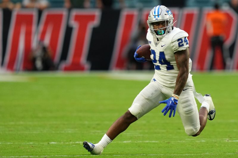 Sep 24, 2022; Miami Gardens, Florida, USA; Middle Tennessee Blue Raiders running back Darius Bracy (24) runs the ball against the Miami Hurricanes during the second half at Hard Rock Stadium. Mandatory Credit: Jasen Vinlove-USA TODAY Sports