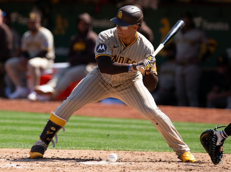 Sep 16, 2023; Oakland, California, USA; San Diego Padres left fielder Juan Soto (22) takes ball four for a bases-loaded walk against the Oakland Athletics during the fourth inning at Oakland-Alameda County Coliseum. Mandatory Credit: D. Ross Cameron-USA TODAY Sports