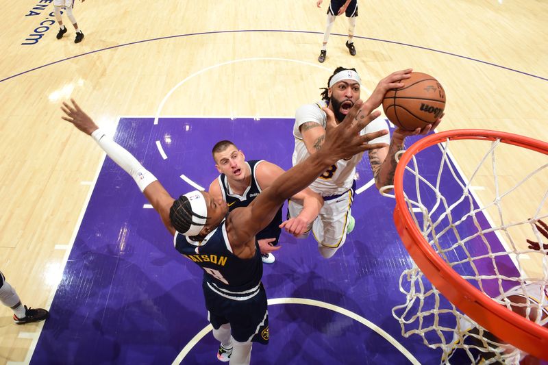 LOS ANGELES, CA - APRIL 27: Anthony Davis #3 of the Los Angeles Lakers drives to the basket during the game against the Denver Nuggets during Round 1 Game 4 of the 2024 NBA Playoffs on April 27, 2024 at Crypto.Com Arena in Los Angeles, California. NOTE TO USER: User expressly acknowledges and agrees that, by downloading and/or using this Photograph, user is consenting to the terms and conditions of the Getty Images License Agreement. Mandatory Copyright Notice: Copyright 2024 NBAE (Photo by Andrew D. Bernstein/NBAE via Getty Images)