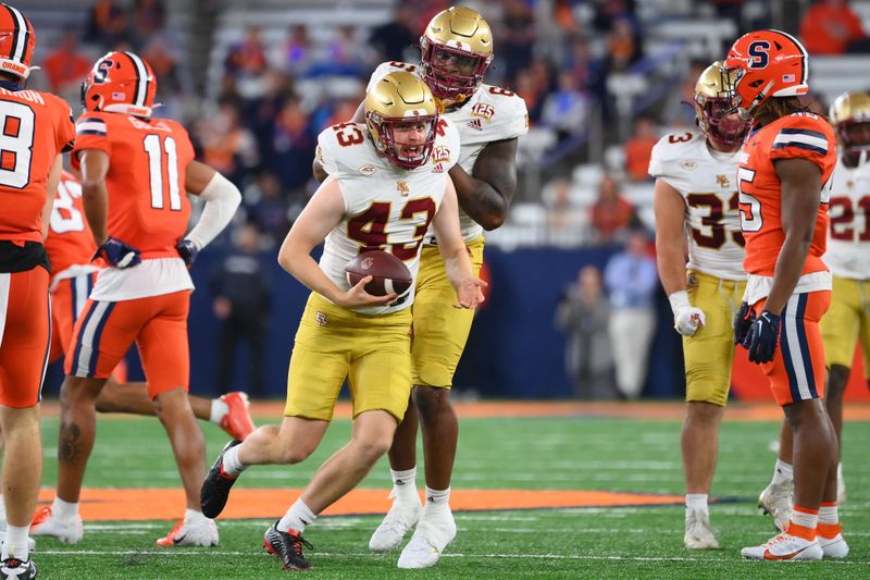 Nov 3, 2023; Syracuse, New York, USA; Boston College Eagles punter Sam Candotti (43) celebrates his fake punt run for a first down against the Syracuse Orange during the second half at the JMA Wireless Dome. Mandatory Credit: Rich Barnes-USA TODAY Sports