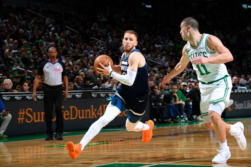 BOSTON, MA - NOVEMBER 24: Donte DiVincenzo #0 of the Minnesota Timberwolves drives to the basket during the game against the Boston Celtics on November 24, 2024 at the TD Garden in Boston, Massachusetts. NOTE TO USER: User expressly acknowledges and agrees that, by downloading and or using this photograph, User is consenting to the terms and conditions of the Getty Images License Agreement. Mandatory Copyright Notice: Copyright 2024 NBAE(Photo by Brian Babineau/NBAE via Getty Images)