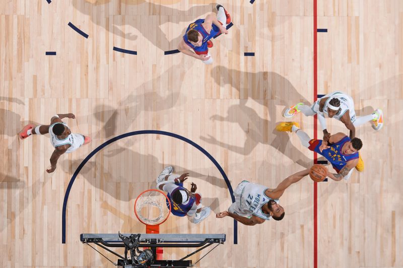 DENVER, CO - MARCH 29: Rudy Gobert #27 of the Minnesota Timberwolves rebounds the ball during the game against the Denver Nuggets on March 29, 2024 at the Ball Arena in Denver, Colorado. NOTE TO USER: User expressly acknowledges and agrees that, by downloading and/or using this Photograph, user is consenting to the terms and conditions of the Getty Images License Agreement. Mandatory Copyright Notice: Copyright 2024 NBAE (Photo by Bart Young/NBAE via Getty Images)