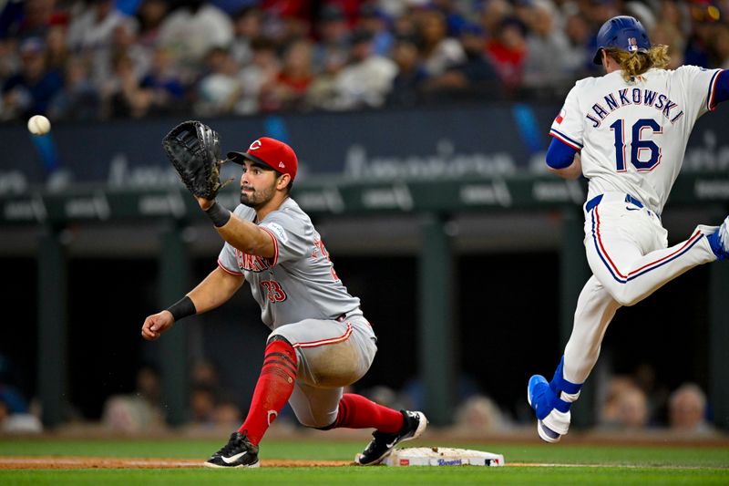 Apr 27, 2024; Arlington, Texas, USA; Cincinnati Reds first baseman Christian Encarnacion-Strand (33) puts out Texas Rangers right fielder Travis Jankowski (16) to end the fifth inning at Globe Life Field. Mandatory Credit: Jerome Miron-USA TODAY Sports