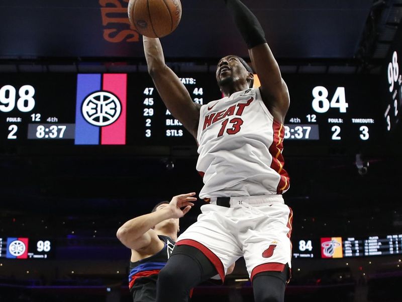 DETROIT, MI - NOOVEMBER 12:  Bam Adebayo #13 of the Miami Heat dunks the ball during the game against the Detroit Pistons during the Emirates NBA Cup game on November 12, 2024 at Little Caesars Arena in Detroit, Michigan. NOTE TO USER: User expressly acknowledges and agrees that, by downloading and/or using this photograph, User is consenting to the terms and conditions of the Getty Images License Agreement. Mandatory Copyright Notice: Copyright 2024 NBAE (Photo by Brian Sevald/NBAE via Getty Images)