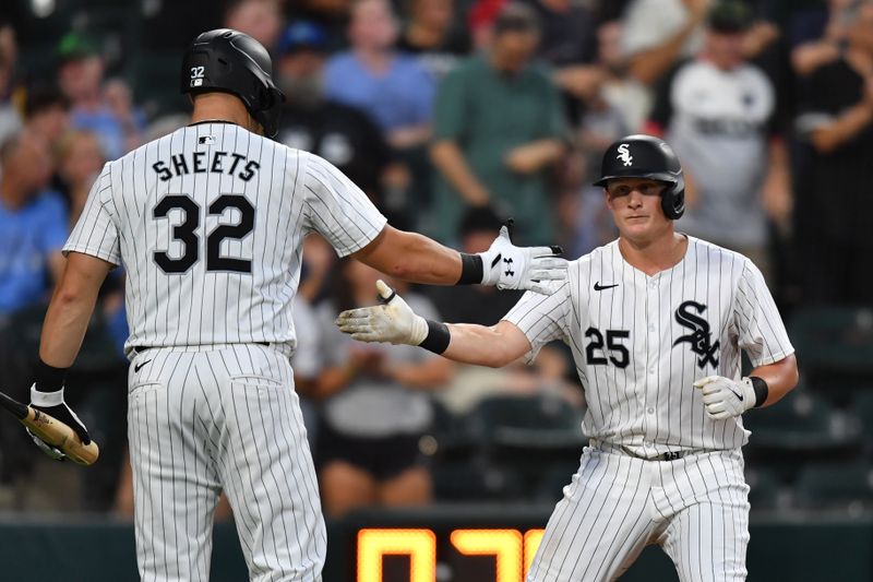 Jul 30, 2024; Chicago, Illinois, USA; Chicago White Sox first base Andrew Vaughn (25) celebrates his home run with right fielder Gavin Sheets (32) during the fourth inning against the Kansas City Royals at Guaranteed Rate Field. Mandatory Credit: Patrick Gorski-USA TODAY Sports