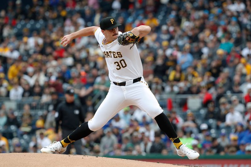 May 11, 2024; Pittsburgh, Pennsylvania, USA;  Pittsburgh Pirates starting pitcher Paul Skenes (30) delivers a pitch in his major league debut against the Chicago Cubs during the first inning at PNC Park. Mandatory Credit: Charles LeClaire-USA TODAY Sports