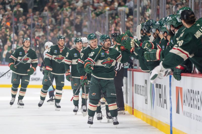 Oct 12, 2024; Saint Paul, Minnesota, USA; Minnesota Wild right wing Mats Zuccarello (36) scores and is congratulated by teammates in the first period against the Seattle Kraken at Xcel Energy Center. Mandatory Credit: Matt Blewett-Imagn Images