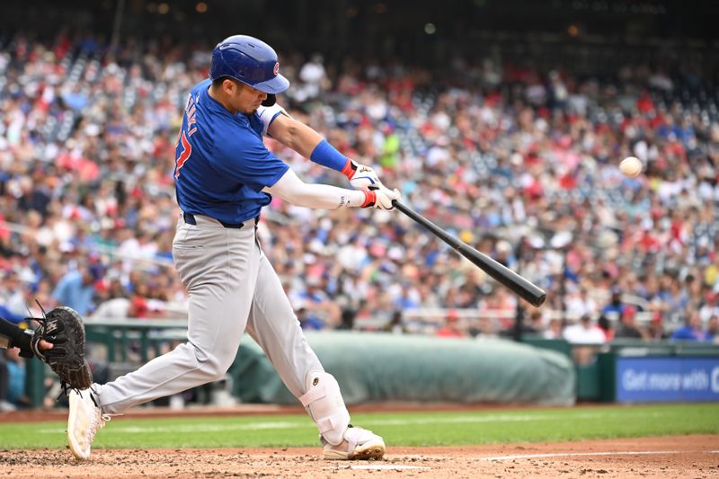 Aug 31, 2024; Washington, District of Columbia, USA; Chicago Cubs right fielder Seiya Suzuki (27) hits the ball into play against the Washington Nationals during the fourth inning at Nationals Park. Mandatory Credit: Rafael Suanes-USA TODAY Sports