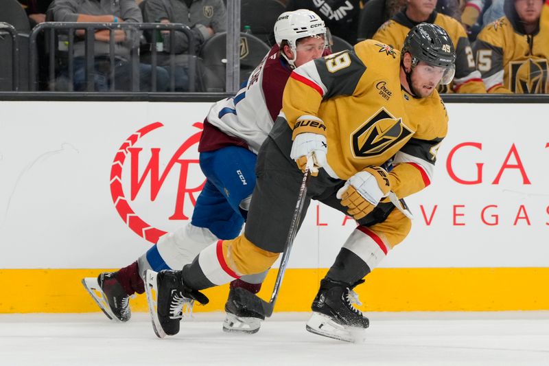 Oct 9, 2024; Las Vegas, Nevada, USA; Vegas Golden Knights center Ivan Barbashev (49) skates against Colorado Avalanche center Calum Ritchie (71) during the third period at T-Mobile Arena. Mandatory Credit: Lucas Peltier-Imagn Images