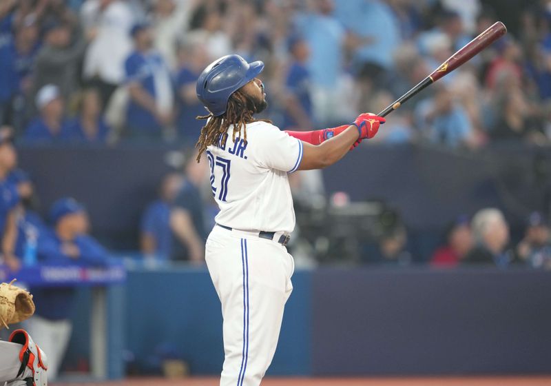 Jun 29, 2023; Toronto, Ontario, CAN; Toronto Blue Jays designated hitter Vladimir Guerrero Jr. (27) reacts after hitting a two run home run against the San Francisco Giants during the sixth inning at Rogers Centre. Mandatory Credit: Nick Turchiaro-USA TODAY Sports