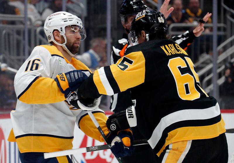 Apr 15, 2024; Pittsburgh, Pennsylvania, USA;  Nashville Predators left wing Jason Zucker (16) and Pittsburgh Penguins defenseman Erik Karlsson (65) continue to jostle after the whistle during the second period at PPG Paints Arena. Mandatory Credit: Charles LeClaire-USA TODAY Sports