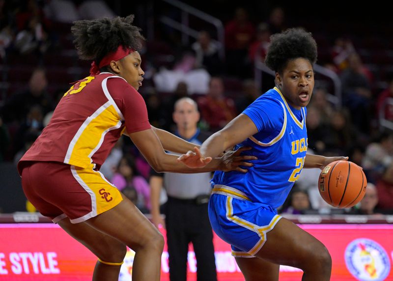 Dec 15, 2022; Los Angeles, California, USA;  USC Trojans guard Rayah Marshall (13) defends UCLA Bruins center Christeen Iwuala (22) in the second half at Galen Center. Mandatory Credit: Jayne Kamin-Oncea-USA TODAY Sports