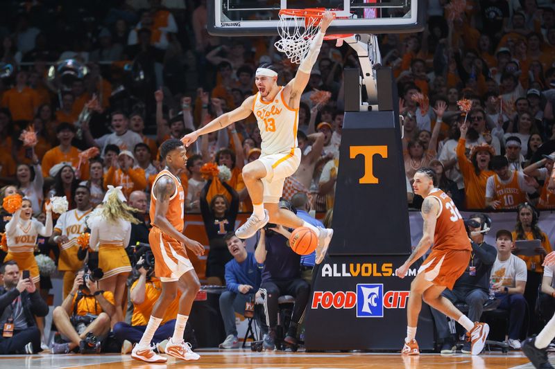 Jan 28, 2023; Knoxville, Tennessee, USA; Tennessee Volunteers forward Olivier Nkamhoua (13) dunks the ball against the Texas Longhorns during the second half at Thompson-Boling Arena. Mandatory Credit: Randy Sartin-USA TODAY Sports