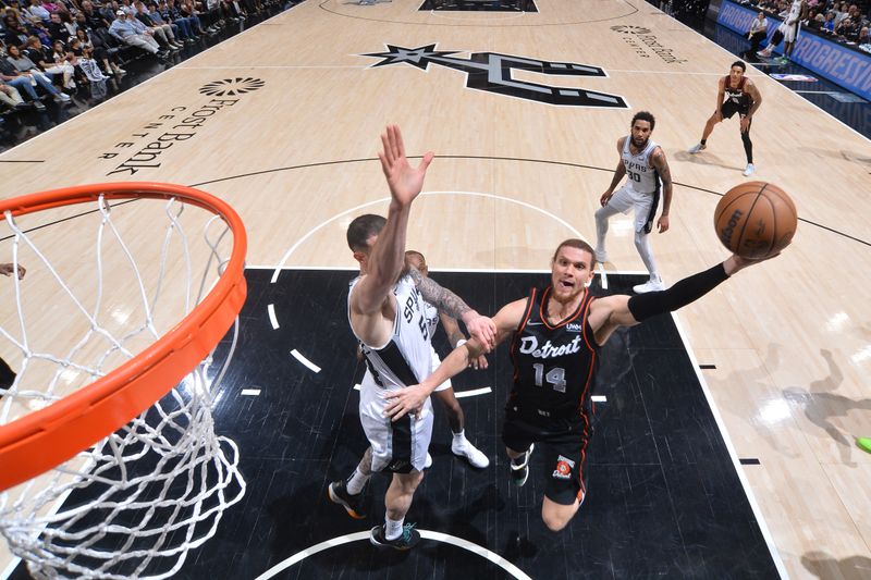 SAN ANTONIO, TX - APRIL 14: Malachi Flynn #14 of the Detroit Pistons drives to the basket during the game against the San Antonio Spurs on April 14, 2024 at the Frost Bank Center in San Antonio, Texas. NOTE TO USER: User expressly acknowledges and agrees that, by downloading and or using this photograph, user is consenting to the terms and conditions of the Getty Images License Agreement. Mandatory Copyright Notice: Copyright 2024 NBAE (Photos by Michael Gonzales/NBAE via Getty Images)