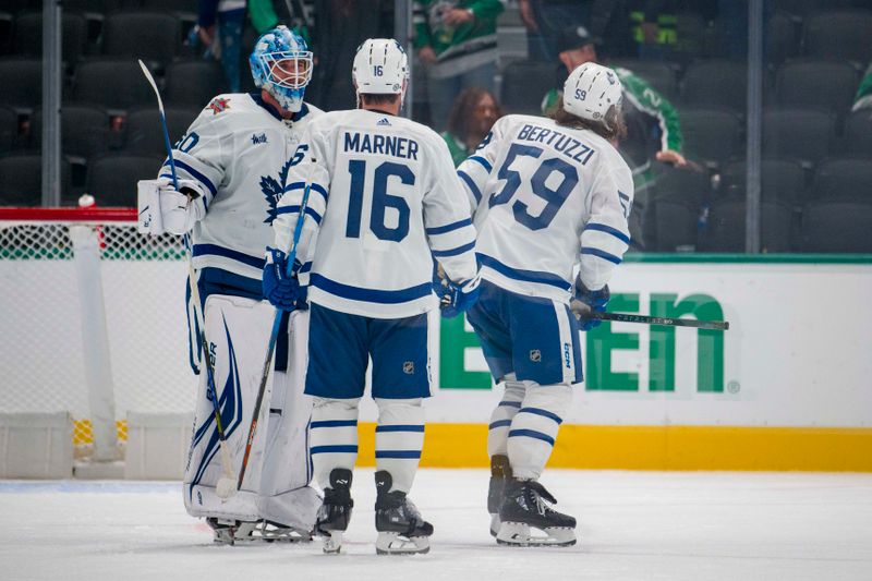 Oct 26, 2023; Dallas, Texas, USA; Toronto Maple Leafs goaltender Joseph Woll (60) and left wing Tyler Bertuzzi (59) and right wing Mitchell Marner (16) celebrate on the ice after their victory over the Dallas Stars at the American Airlines Center. Mandatory Credit: Jerome Miron-USA TODAY Sports