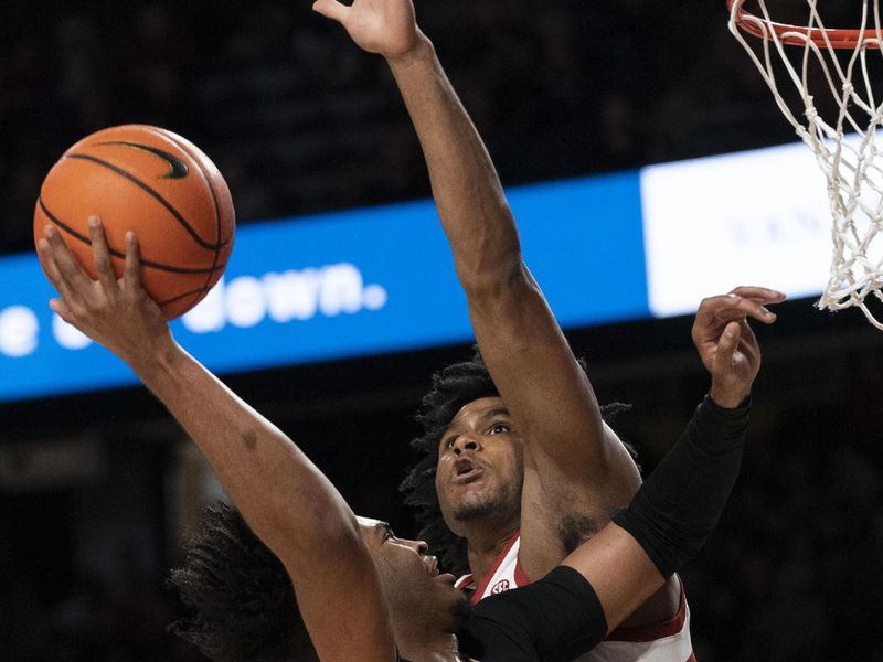 Jan 14, 2023; Nashville, Tennessee, USA;   
Vanderbilt Commodores forward Colin Smith (1) shoots the ball against the Arkansas Razorbacks during the first half at Memorial Gymnasium. Mandatory Credit: George Walker IV - USA TODAY Sports