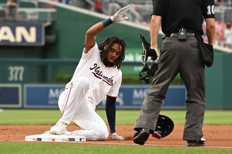 Aug 6, 2024; Washington, District of Columbia, USA; Washington Nationals center fielder James Wood (29) slides into third base after hitting a triple against the San Francisco Giants during the second inning at Nationals Park. Mandatory Credit: Rafael Suanes-USA TODAY Sports
