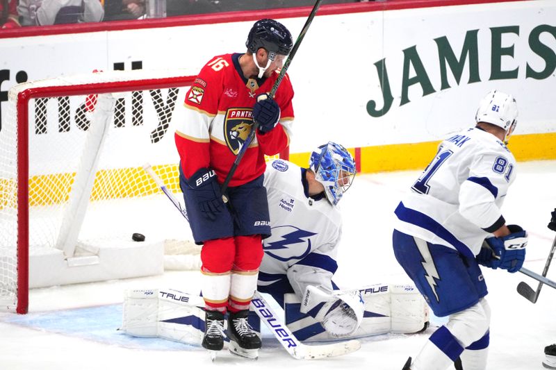 Sep 30, 2024; Sunrise, Florida, USA;  Florida Panthers center Aleksander Barkov (16) blocks the view of Tampa Bay Lightning goaltender Jonas Johansson (31) on a goal  by Florida Panthers center Sam Reinhart (13) during the third period at Amerant Bank Arena. Mandatory Credit: Jim Rassol-Imagn Images