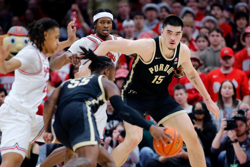 Feb 18, 2024; Columbus, Ohio, USA;  Purdue Boilermakers center Zach Edey (15) looks for the ball as Ohio State Buckeyes center Felix Okpara (34) defends during the second half at Value City Arena. Mandatory Credit: Joseph Maiorana-USA TODAY Sports