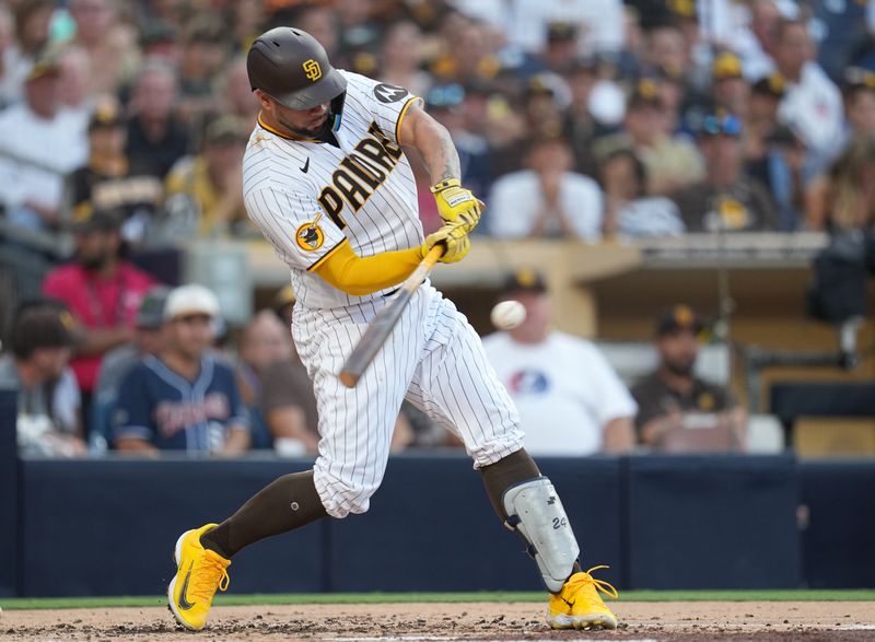 Jul 25, 2023; San Diego, California, USA; San Diego Padres catcher Gary Sanchez (99) hits an RBI single scoring designated hitter Luis Campusano (not pictured) during the second inning against the Pittsburgh Pirates at Petco Park. Mandatory Credit: Ray Acevedo-USA TODAY Sports