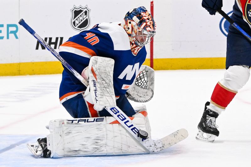 Jan 27, 2024; Elmont, New York, USA; New York Islanders goaltender Semyon Varlamov (40) makes a save against against the Florida Panthers during the third period at UBS Arena. Mandatory Credit: Dennis Schneidler-USA TODAY Sports