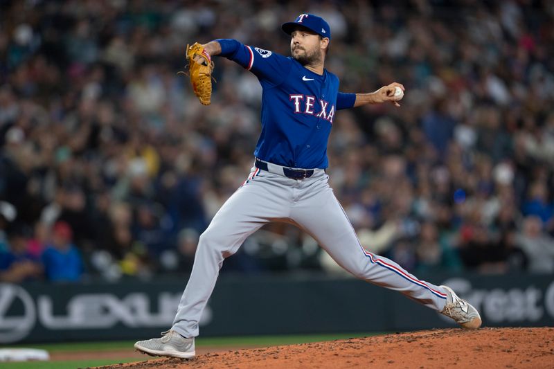 Jun 15, 2024; Seattle, Washington, USA; Texas Rangers reliever Brock Burke (46) delivers a pitch during the fourth inning against the Seattle Mariners at T-Mobile Park. Mandatory Credit: Stephen Brashear-USA TODAY Sports