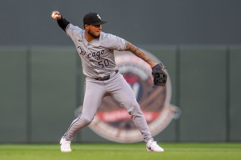 Aug 2, 2024; Minneapolis, Minnesota, USA; Chicago White Sox second baseman Lenyn Sosa (50) throws the ball to first base for an out against the Minnesota Twins in the second inning at Target Field. Mandatory Credit: Jesse Johnson-USA TODAY Sports