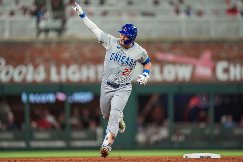 May 15, 2024; Cumberland, Georgia, USA; Chicago Cubs right fielder Seiya Suzuki (27) reacts after hitting a home run against the Atlanta Braves during the eighth inning at Truist Park. Mandatory Credit: Dale Zanine-USA TODAY Sports