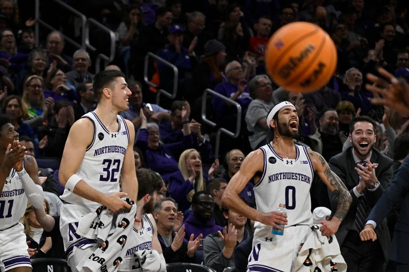 Jan 27, 2024; Evanston, Illinois, USA; Northwestern Wildcats forward Blake Preston (32) and Northwestern Wildcats guard Boo Buie (0) celebrate against Ohio State Buckeyes during the second half  at Welsh-Ryan Arena. Mandatory Credit: Matt Marton-USA TODAY Sports