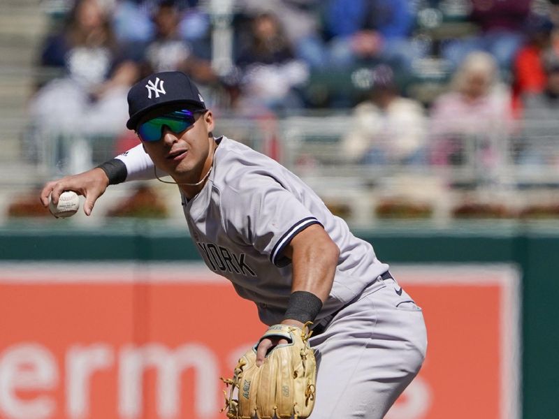 Apr 26, 2023; Minneapolis, Minnesota, USA; New York Yankees infielder Anthony Volpe (11) throws to first base for a force out against the Minnesota Twins during the seventh inning at Target Field. Mandatory Credit: Nick Wosika-USA TODAY Sports

