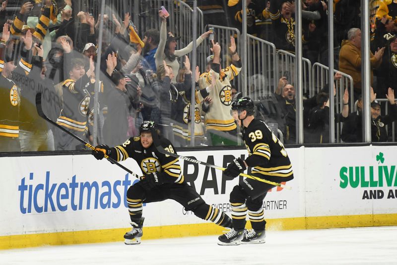 May 4, 2024; Boston, Massachusetts, USA; Boston Bruins right wing David Pastrnak (88) reacts with center Morgan Geekie (39) after scoring the game winning goal during overtime in game seven of the first round of the 2024 Stanley Cup Playoffs against the Toronto Maple Leafs at TD Garden. Mandatory Credit: Bob DeChiara-USA TODAY Sports