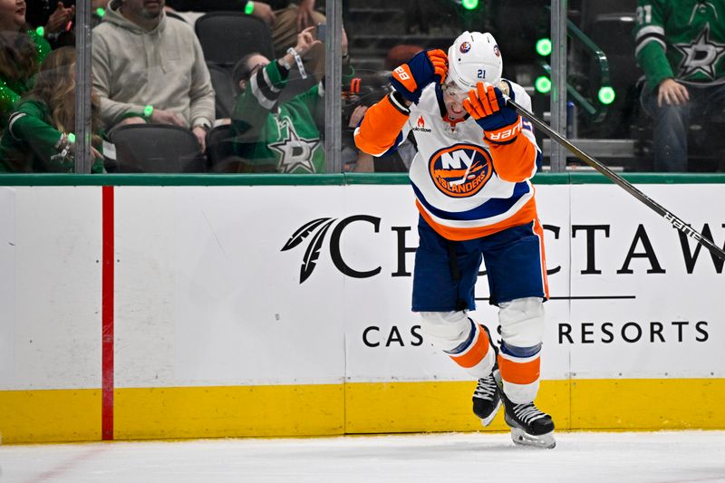 Oct 12, 2024; Dallas, Texas, USA; New York Islanders center Kyle Palmieri (21) puts his helmet back on during the third period against the Dallas Stars at the American Airlines Center. Mandatory Credit: Jerome Miron-Imagn Images