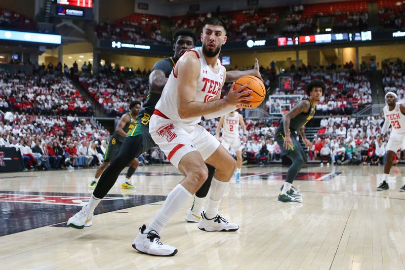 Jan 17, 2023; Lubbock, Texas, USA; Texas Tech Red Raiders forward Fardaws Aimaq (11) works the ball against  Baylor Bears forward Josh Ojianwuna (15) in the first half at United Supermarkets Arena. Mandatory Credit: Michael C. Johnson-USA TODAY Sports