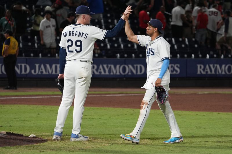 Sep 21, 2025; Tampa, Florida, USA; Tampa Bay Rays relief pitcher Pete Fairbanks (29) and outfielder Christopher Morel (24) celebrate after defeating the Boston Red Sox at George M. Steinbrenner Field. Mandatory Credit: Dave Nelson-Imagn Images
