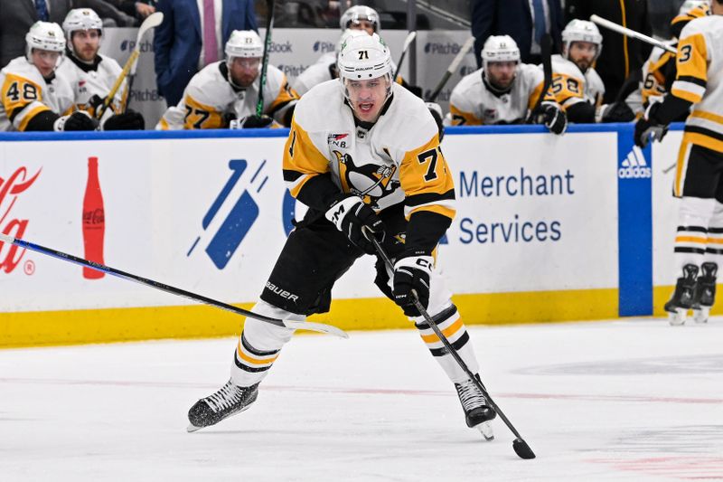 Apr 17, 2024; Elmont, New York, USA;  Pittsburgh Penguins center Evgeni Malkin (71) skates with the puck against the New York Islanders during the third period at UBS Arena. Mandatory Credit: Dennis Schneidler-USA TODAY Sports