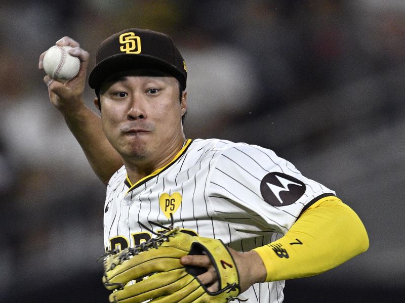 Jun 24, 2024; San Diego, California, USA; San Diego Padres shortstop Ha-Seong Kim (7) throws to first base on a ground out by Washington Nationals center fielder Jacob Young (not pictured) during the seventh inning at Petco Park. Mandatory Credit: Orlando Ramirez-USA TODAY Sports