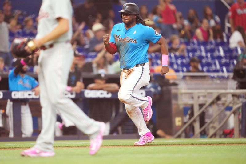 May 12, 2024; Miami, Florida, USA;  Miami Marlins first base Josh Bell (9) scores a run in the second inning against the Philadelphia Phillies at loanDepot Park. Mandatory Credit: Jim Rassol-USA TODAY Sports