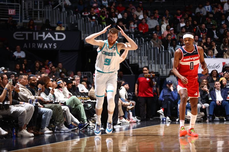 WASHINGTON, DC -? MARCH 8: Davis Bertans #9 of the Charlotte Hornets celebrates a three point basket during the game against the Washington Wizards on March 8, 2024 at Capital One Arena in Washington, DC. NOTE TO USER: User expressly acknowledges and agrees that, by downloading and or using this Photograph, user is consenting to the terms and conditions of the Getty Images License Agreement. Mandatory Copyright Notice: Copyright 2024 NBAE (Photo by Kenny Giarla/NBAE via Getty Images)