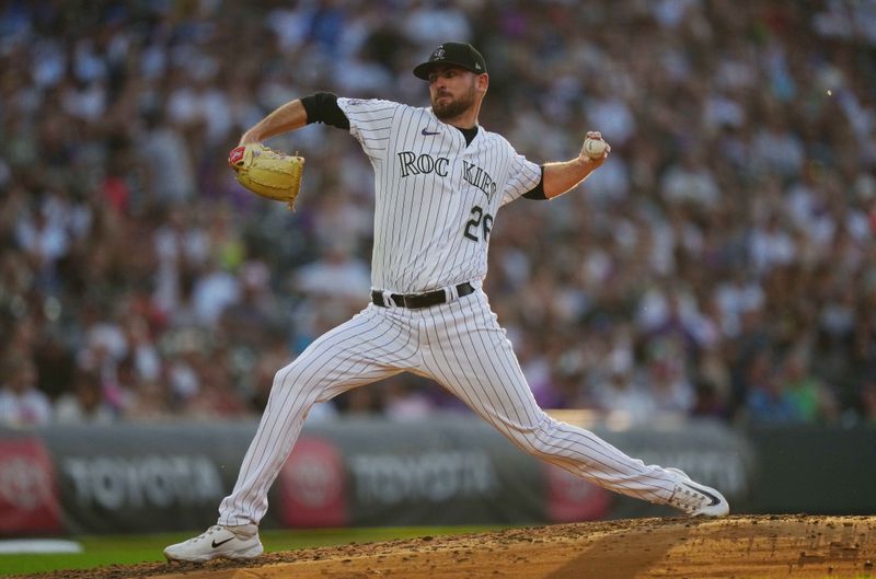 Jul 14, 2023; Denver, Colorado, USA; Colorado Rockies starting pitcher Austin Gomber (26) pitches in fourth inning against the New York Yankees at Coors Field. Mandatory Credit: Ron Chenoy-USA TODAY Sports