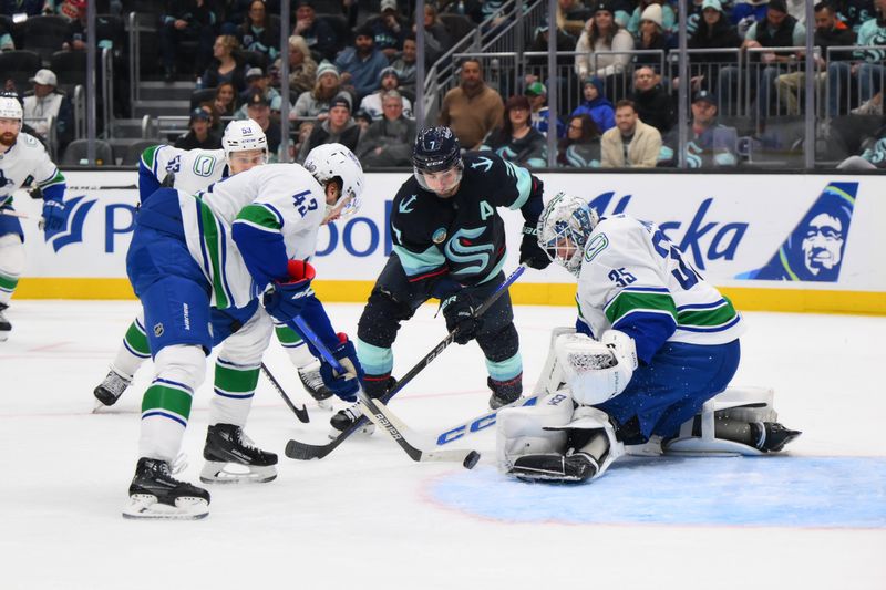 Nov 24, 2023; Seattle, Washington, USA; Vancouver Canucks goaltender Thatcher Demko (35) blocks a goal shot by Seattle Kraken right wing Jordan Eberle (7) during the second period at Climate Pledge Arena. Mandatory Credit: Steven Bisig-USA TODAY Sports