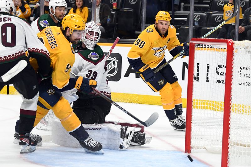 Feb 10, 2024; Nashville, Tennessee, USA; Arizona Coyotes goaltender Connor Ingram (39) watches a rebound in the crease before it is put in the net by Nashville Predators left wing Filip Forsberg (9) during the third period at Bridgestone Arena. Mandatory Credit: Christopher Hanewinckel-USA TODAY Sports