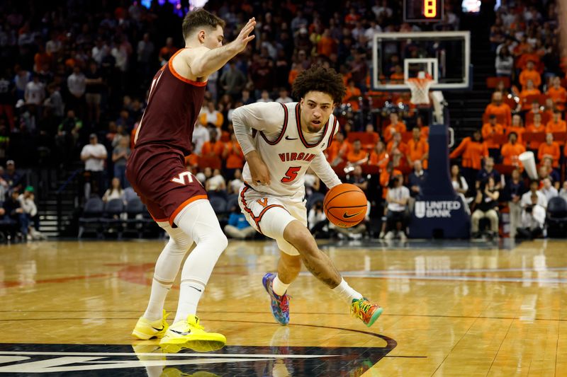 Mar 7, 2026; Charlottesville, Virginia, USA; Virginia Cavaliers guard Sam Lewis (5) drives to the basket as Virginia Tech Hokies guard Jaden Schutt (2) defends in the second half at John Paul Jones Arena. Mandatory Credit: Geoff Burke-Imagn Images