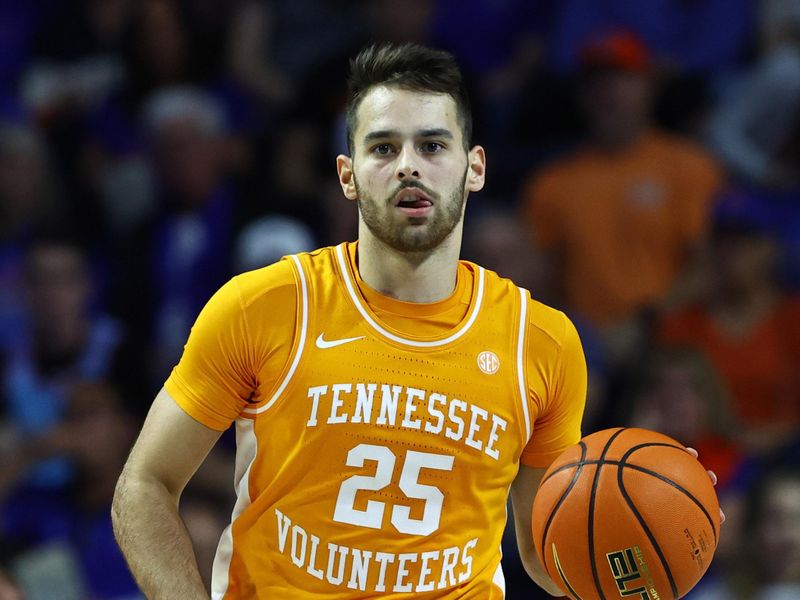 Feb 1, 2023; Gainesville, Florida, USA; Tennessee Volunteers guard Santiago Vescovi (25) dribbles the ball against the Florida Gators during the second half at Exactech Arena at the Stephen C. O'Connell Center. Mandatory Credit: Kim Klement-USA TODAY Sports