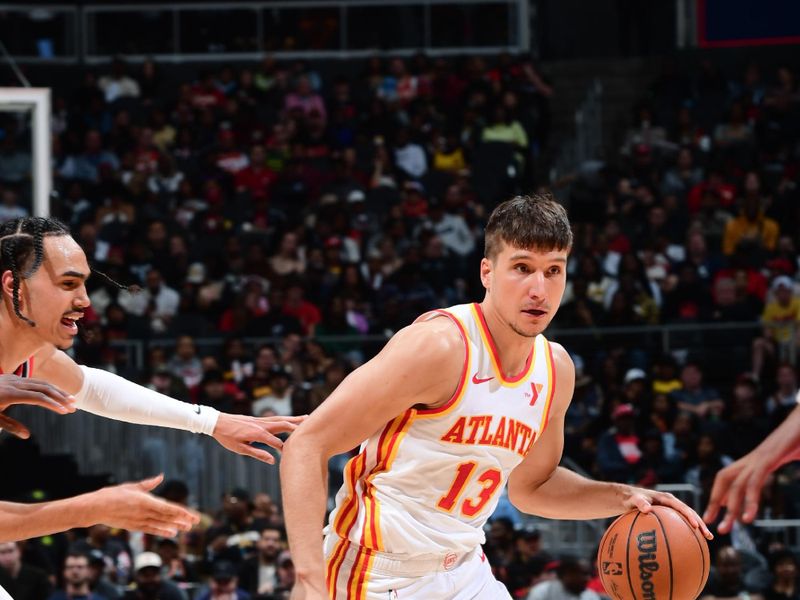 ATLANTA, GA - MARCH 27: Bogdan Bogdanovic #13 of the Atlanta Hawks dribbles the ball during the game against the Portland Trail Blazers on March 27, 2024 at State Farm Arena in Atlanta, Georgia.  NOTE TO USER: User expressly acknowledges and agrees that, by downloading and/or using this Photograph, user is consenting to the terms and conditions of the Getty Images License Agreement. Mandatory Copyright Notice: Copyright 2024 NBAE (Photo by Scott Cunningham/NBAE via Getty Images)