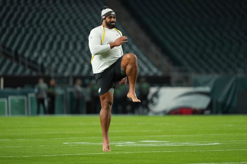 Philadelphia Eagles offensive tackle Jordan Mailata warms up before an NFL football game against the Washington Commanders Thursday, Nov. 14, 2024, in Philadelphia. (AP Photo/Matt Slocum)